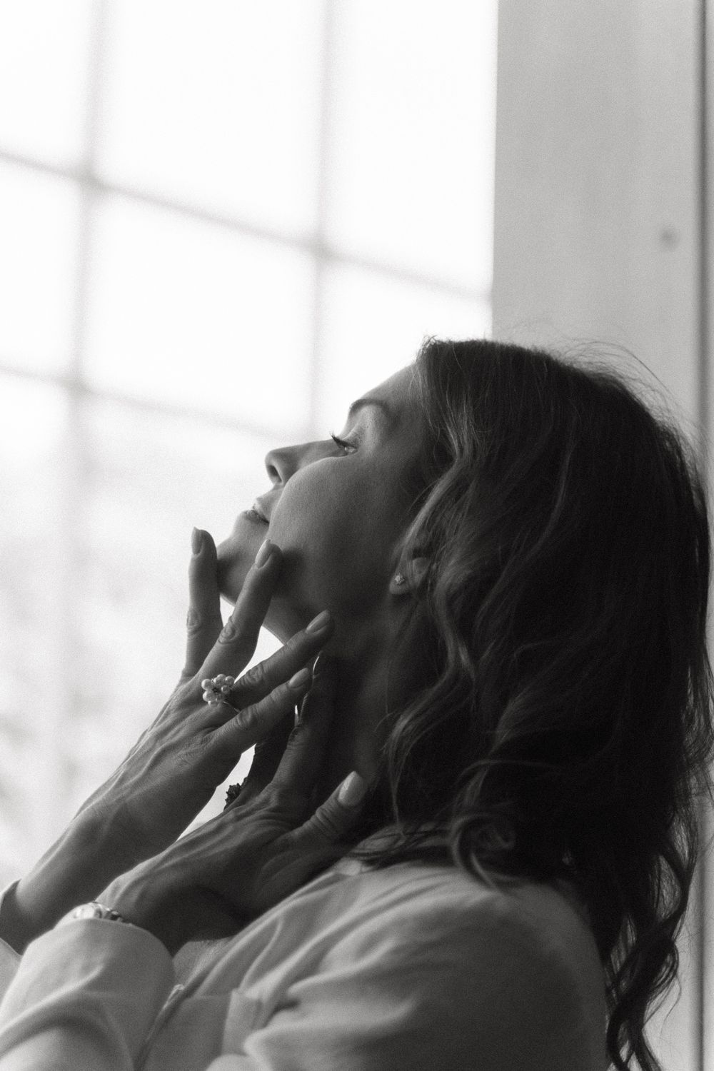 Crown Point Massage model with wind-blown hair smiling