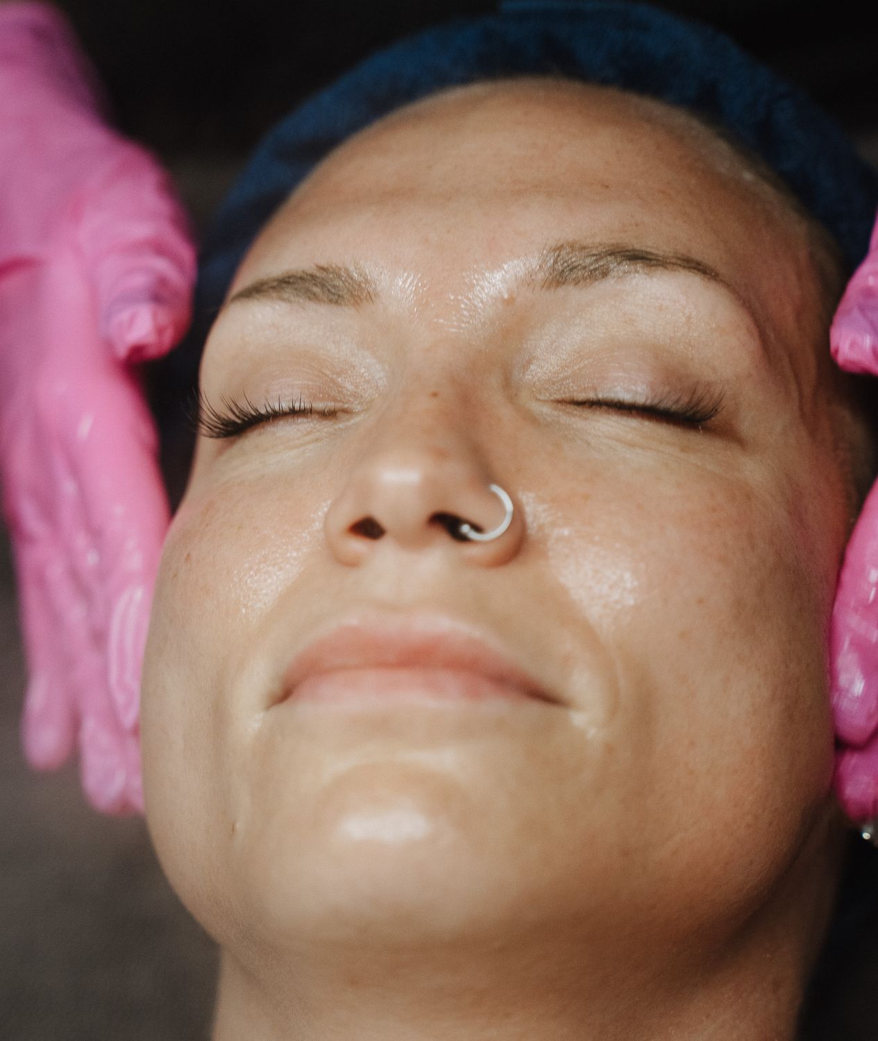 Skincare treatment session with relaxed woman.