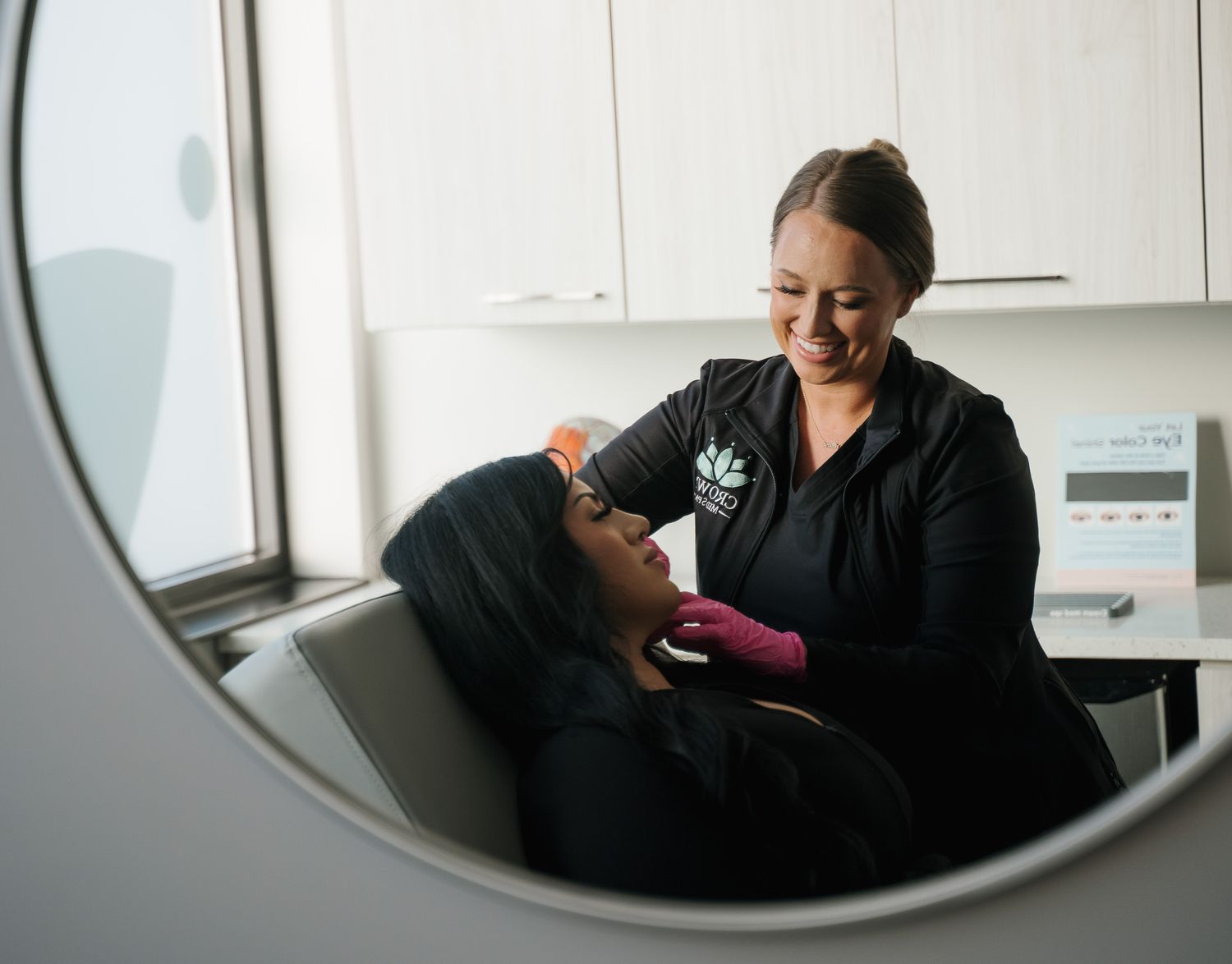 Crown Point Neuromodulator model with wind-blown hair smiling