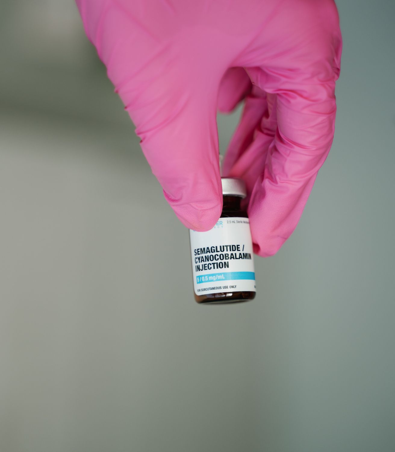 Crown Point Medical Weight Loss model lying in bed with a white blanket covering her