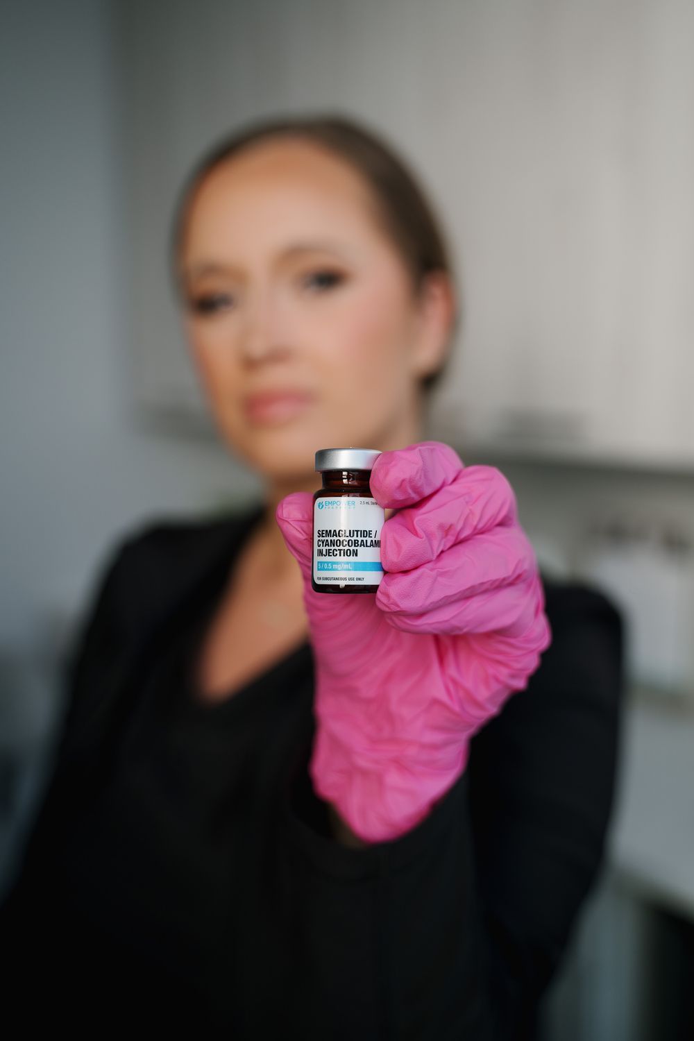 Crown Point Medical Weight Loss model in a white tank top looking up