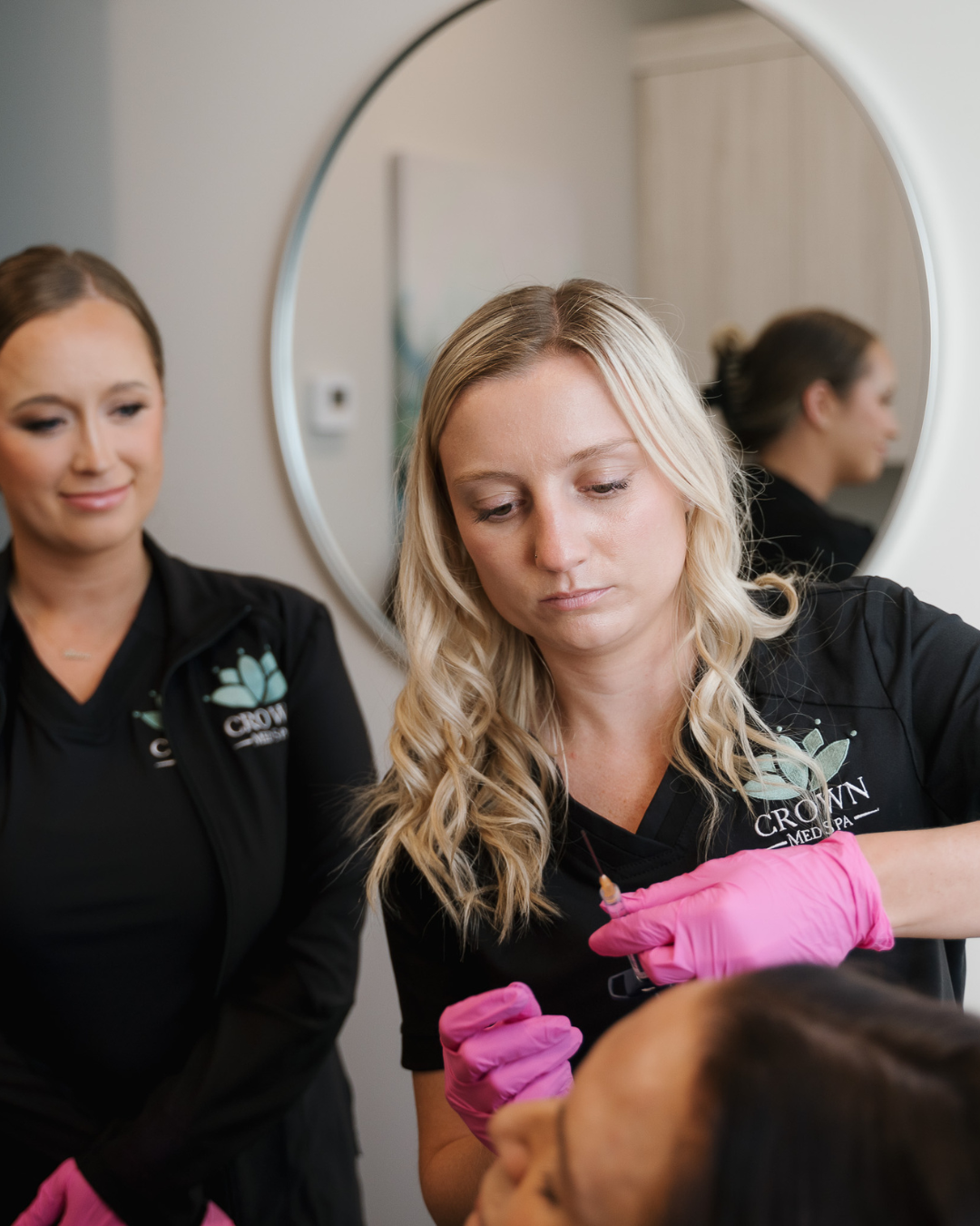 Crown Point Med Spa model lying in bed