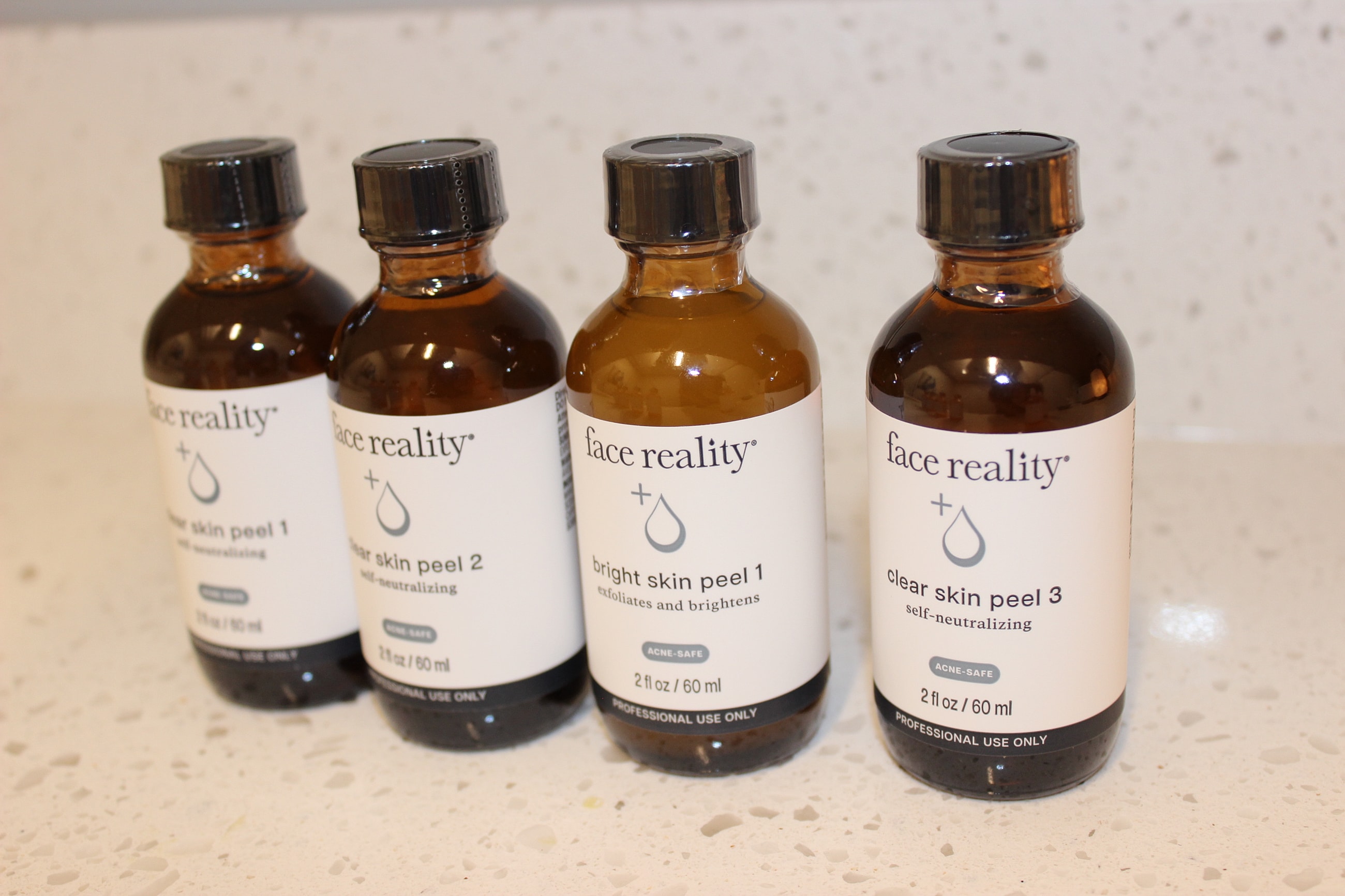Face Reality peel lineup on neutral background.