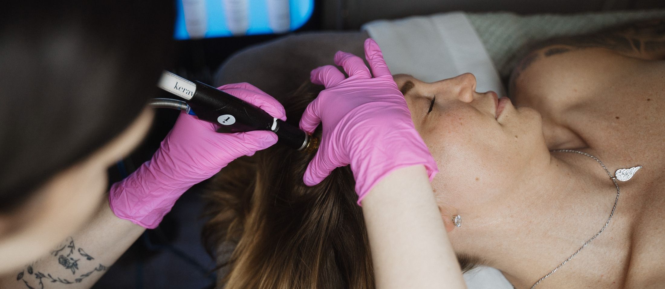 Crown Point Hydrafacial Keravive model wearing sunglasses