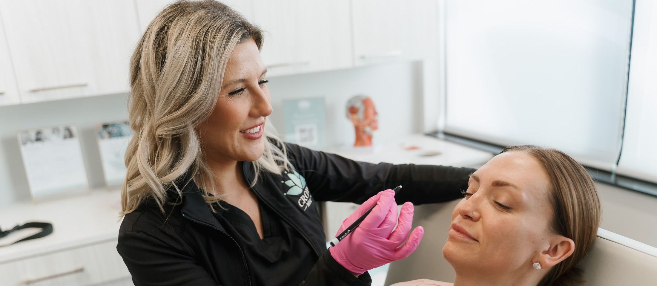 Crown Point Dysport model resting her hand on her chin